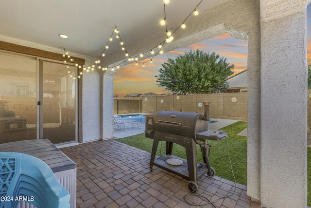 patio terrace at dusk with area for grilling