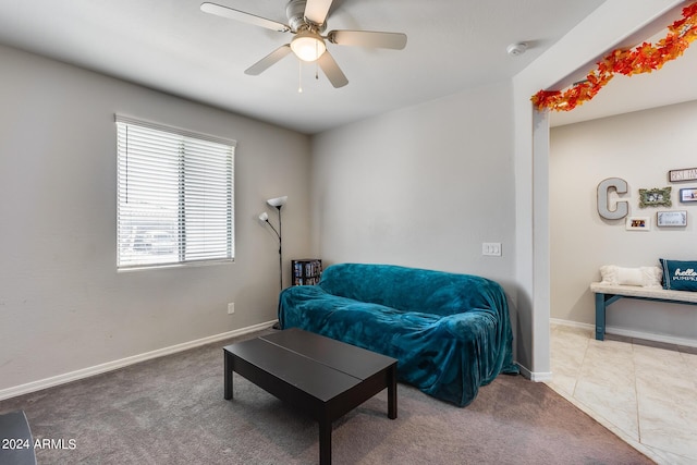 sitting room featuring carpet floors and ceiling fan