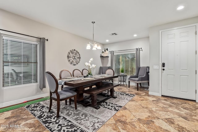 dining room featuring visible vents, stone finish flooring, recessed lighting, baseboards, and a chandelier