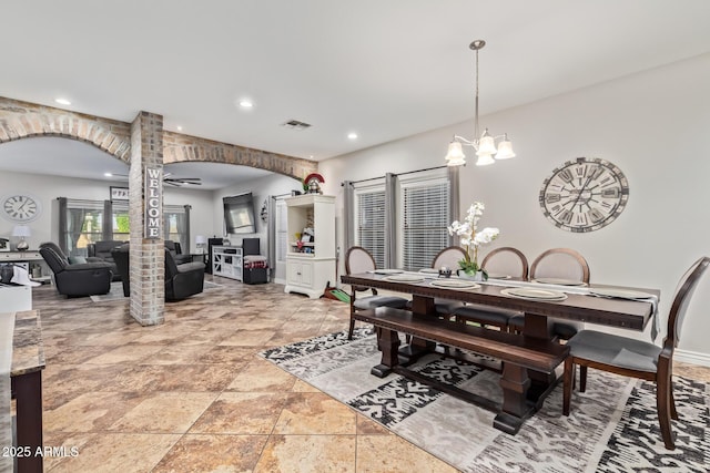 dining space featuring recessed lighting, visible vents, a notable chandelier, and ornate columns