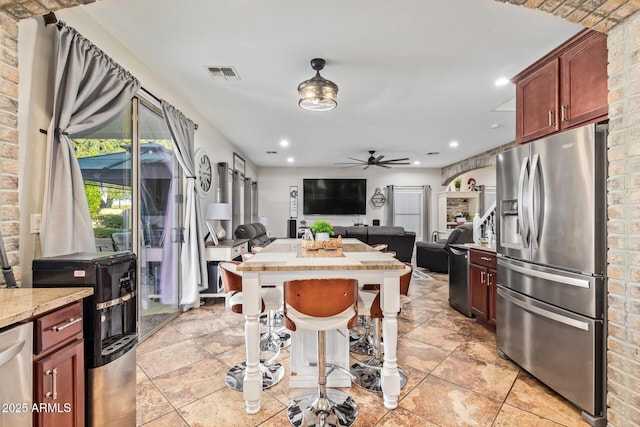 kitchen with a ceiling fan, visible vents, recessed lighting, appliances with stainless steel finishes, and open floor plan