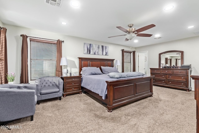 bedroom with recessed lighting, visible vents, light colored carpet, and ceiling fan