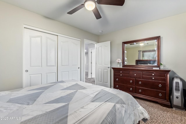 carpeted bedroom featuring a closet and ceiling fan