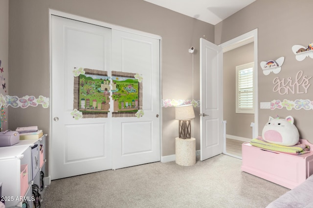 bedroom featuring light carpet