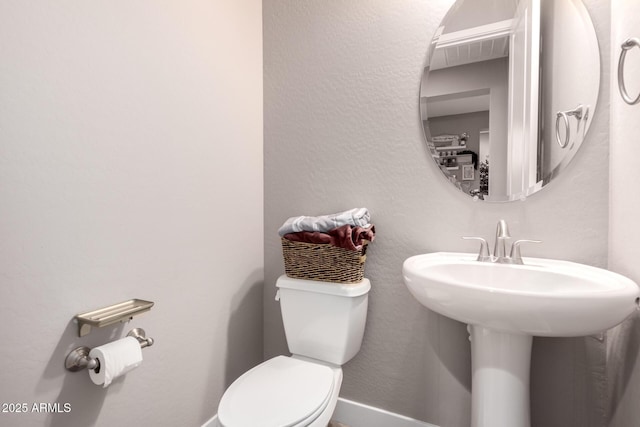 bathroom featuring toilet