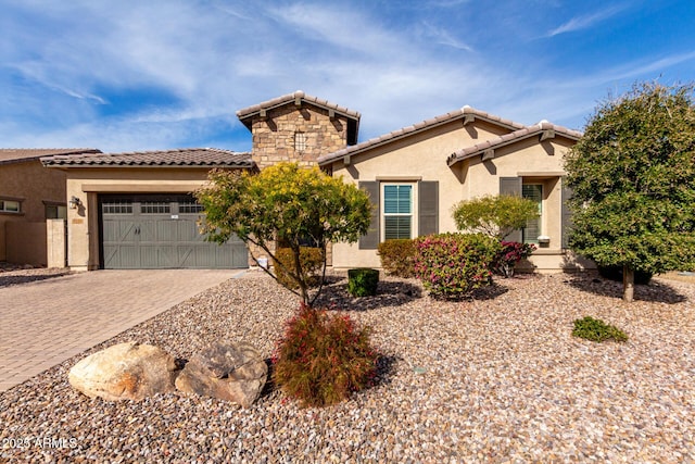 mediterranean / spanish-style house featuring a garage