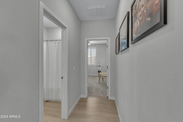 corridor featuring light wood-type flooring