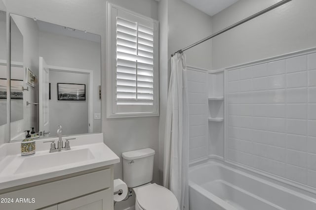 full bathroom featuring vanity, shower / bathtub combination with curtain, and toilet