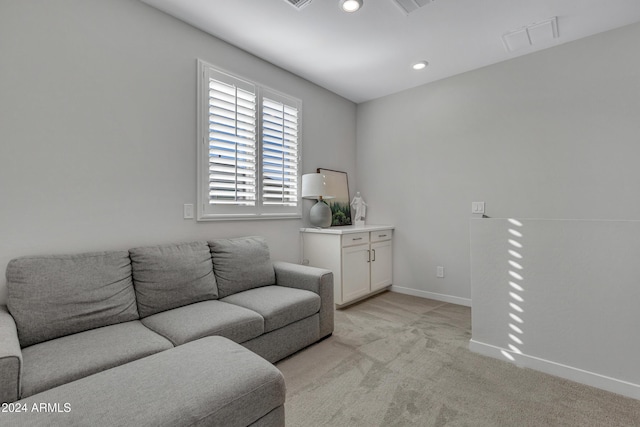 living room with light colored carpet