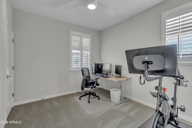 office area with light carpet and ceiling fan