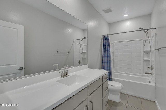 full bathroom featuring vanity, toilet, tile patterned floors, and shower / bath combo with shower curtain