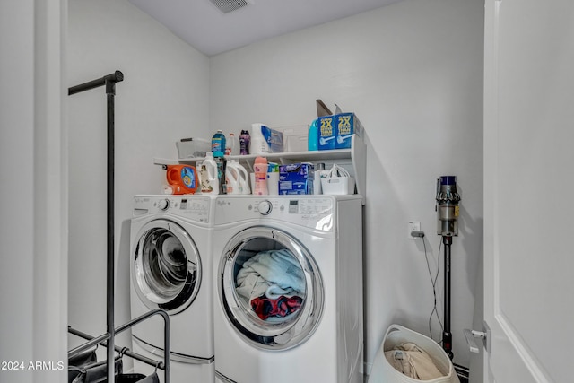 laundry area with separate washer and dryer