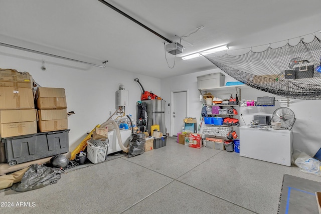 garage with a garage door opener and stainless steel refrigerator