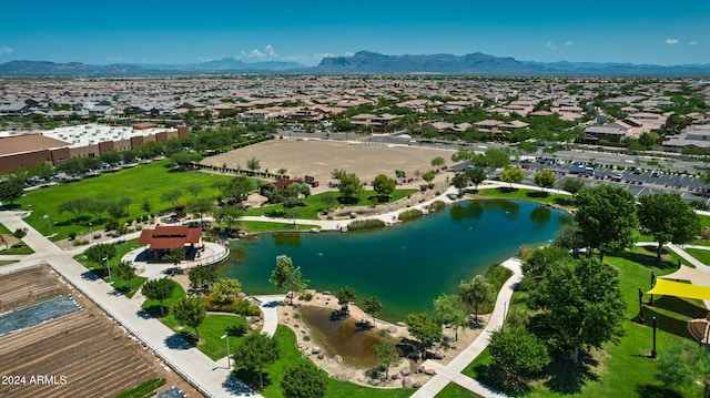 birds eye view of property featuring a water and mountain view