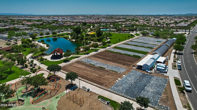 birds eye view of property featuring a water view