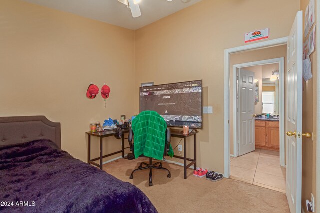 bedroom with ceiling fan and light colored carpet