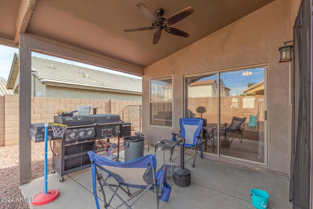 view of patio / terrace with ceiling fan and a grill