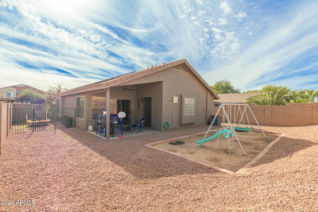 back of house featuring ceiling fan, a patio area, and central AC