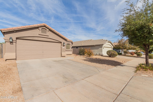 ranch-style home featuring a garage