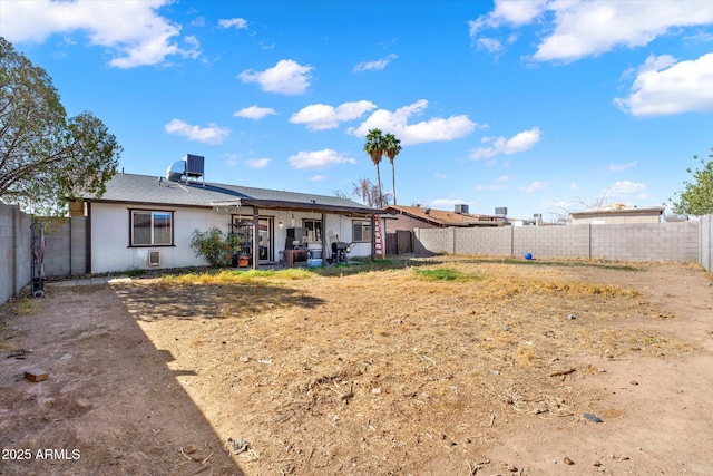 back of property featuring a patio and a fenced backyard