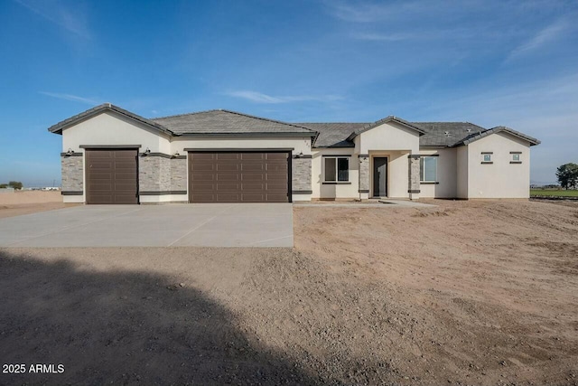 view of front of property with a garage