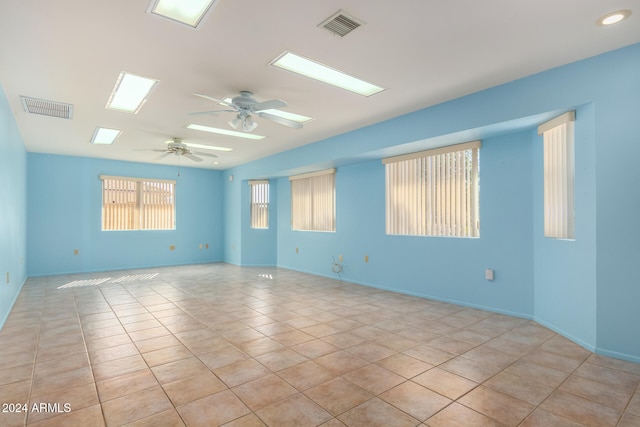 tiled empty room with ceiling fan