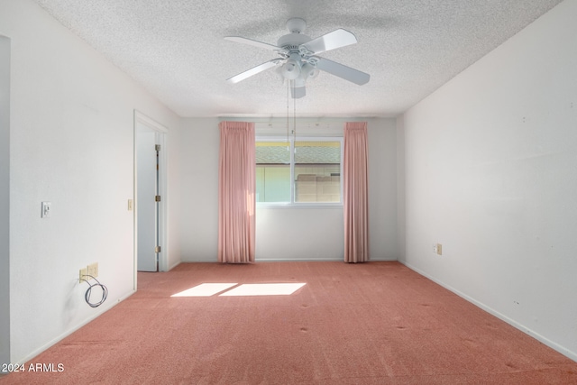 unfurnished room with light carpet, a textured ceiling, and ceiling fan