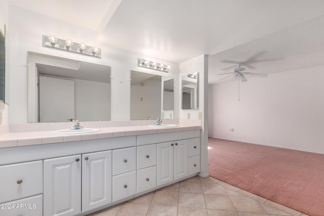 bathroom featuring tile patterned flooring, ceiling fan, and vanity