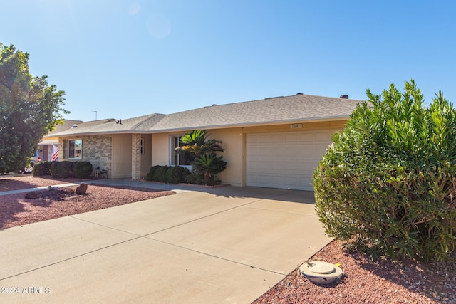 single story home with a garage