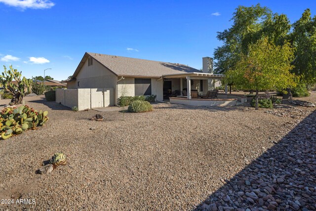 rear view of house featuring a patio