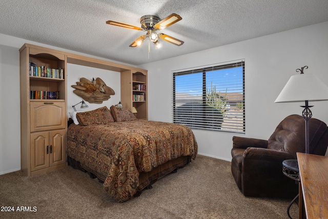 carpeted bedroom with baseboards, a ceiling fan, and a textured ceiling