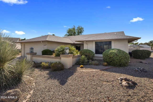 single story home featuring a garage