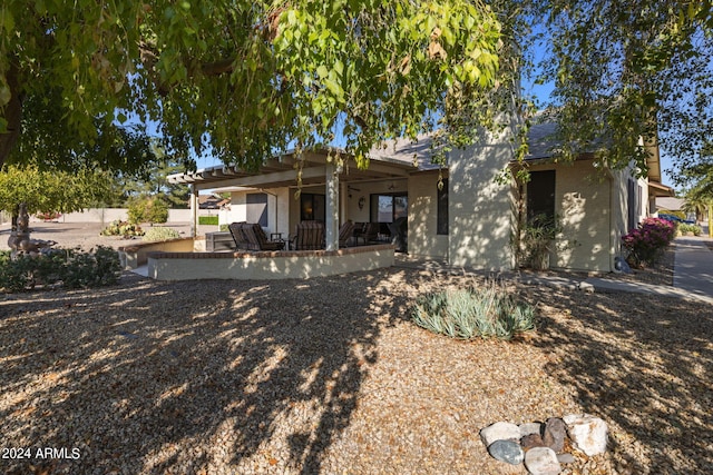 rear view of property featuring a patio
