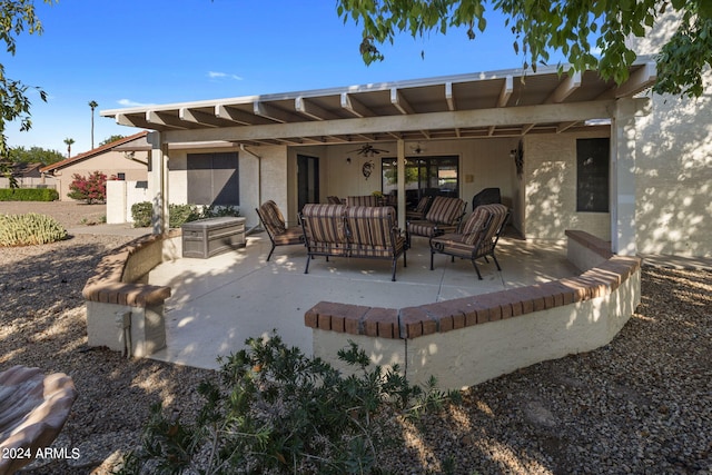 back of property with a patio area, a ceiling fan, and an outdoor hangout area