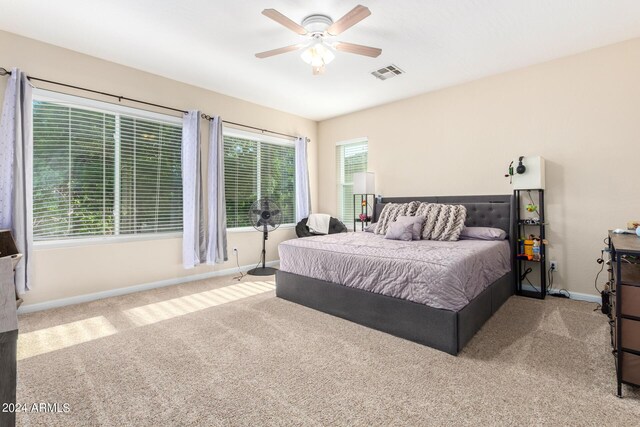 bedroom featuring carpet, baseboards, and a ceiling fan