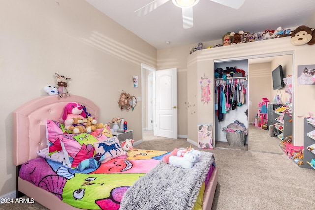 carpeted bedroom with a closet and a ceiling fan