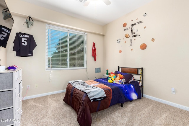 carpeted bedroom with baseboards and ceiling fan