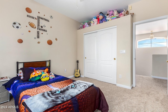 bedroom featuring carpet flooring, a closet, and baseboards