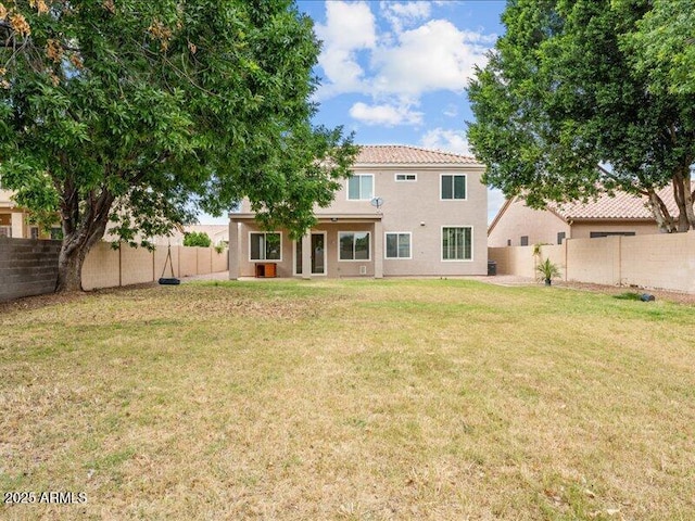 back of property featuring stucco siding and a tile roof