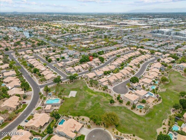 aerial view of property and surrounding area with nearby suburban area