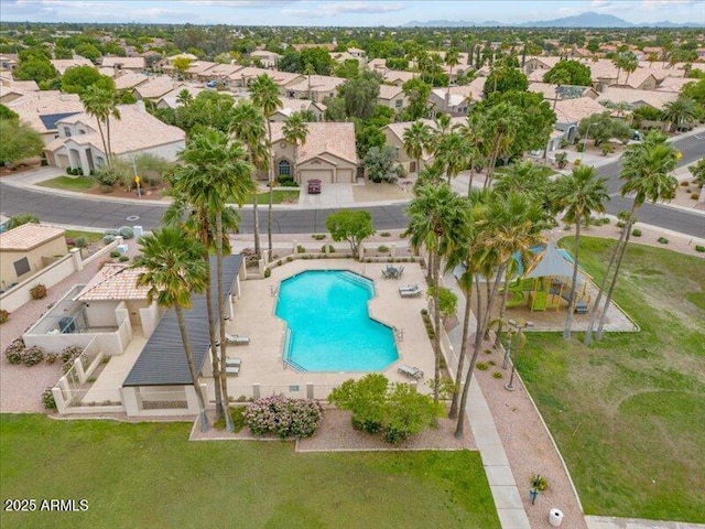 aerial view of residential area with a pool