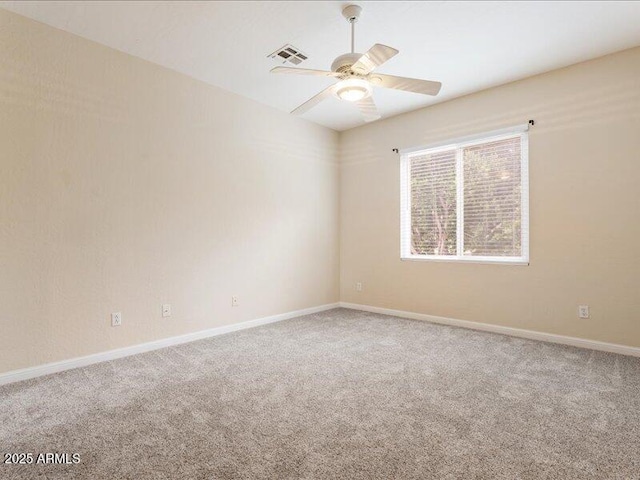 unfurnished room featuring ceiling fan, carpet floors, and baseboards