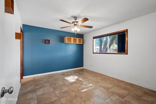 spare room with ceiling fan