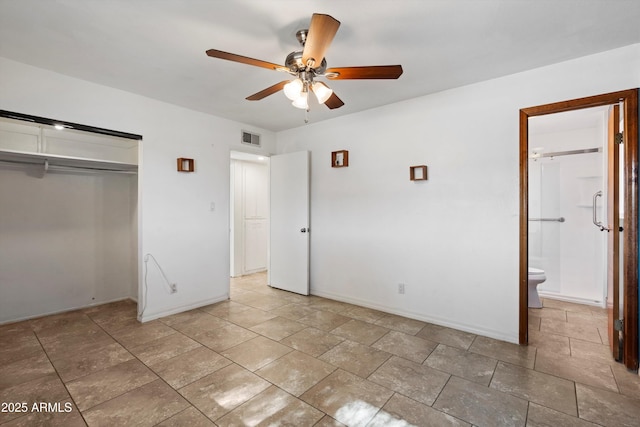 unfurnished bedroom with connected bathroom, a closet, and ceiling fan