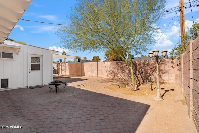 view of patio / terrace featuring an outdoor fire pit