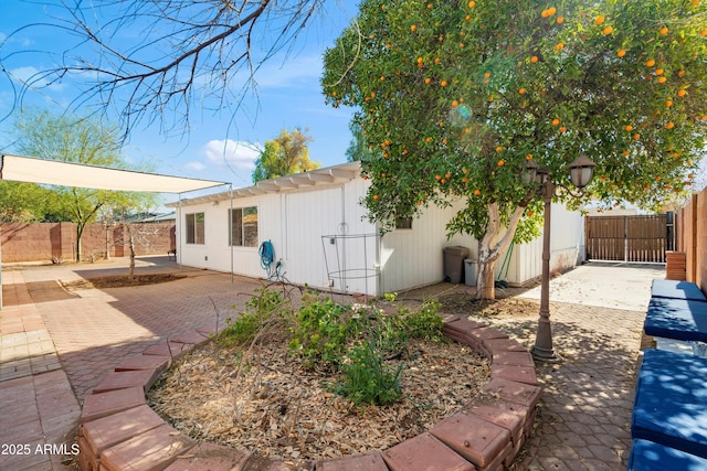 view of property exterior with a patio area