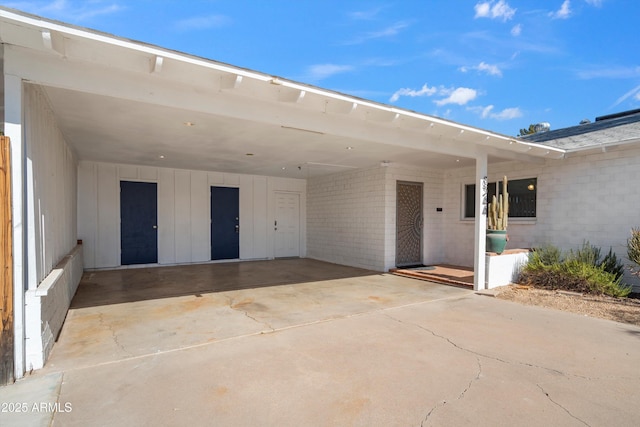 property entrance featuring a carport