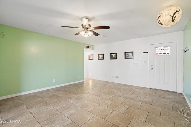 foyer entrance with ceiling fan