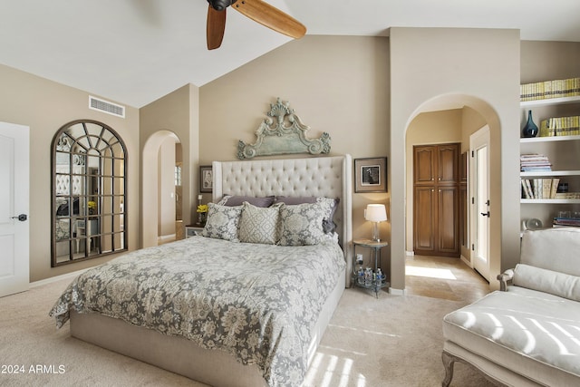 carpeted bedroom featuring lofted ceiling with beams and ceiling fan