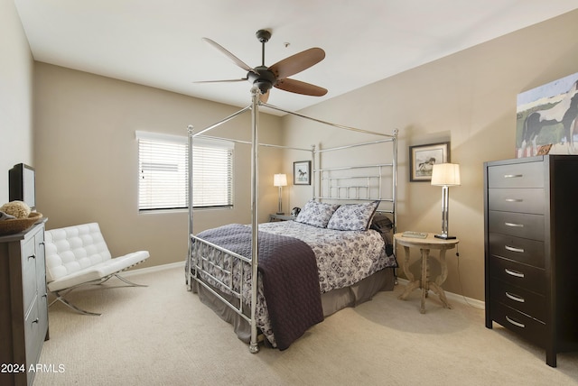 bedroom with light carpet and ceiling fan